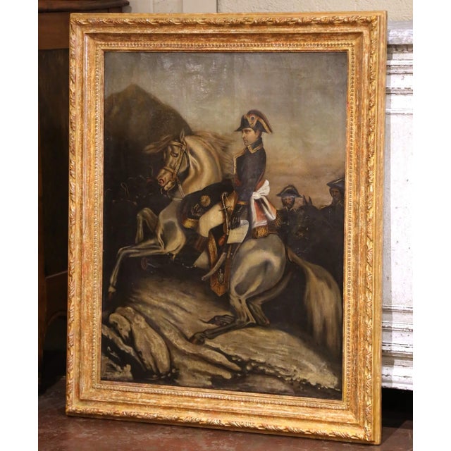 Commanding in both subject and presentation, this antique French oil on canvas depicts Napoleon Bonaparte mounted on a...
