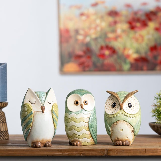 Bring the charm of nature into your home with our Terra Cotta Owl Figurine Set. This delightful trio of owls, each...