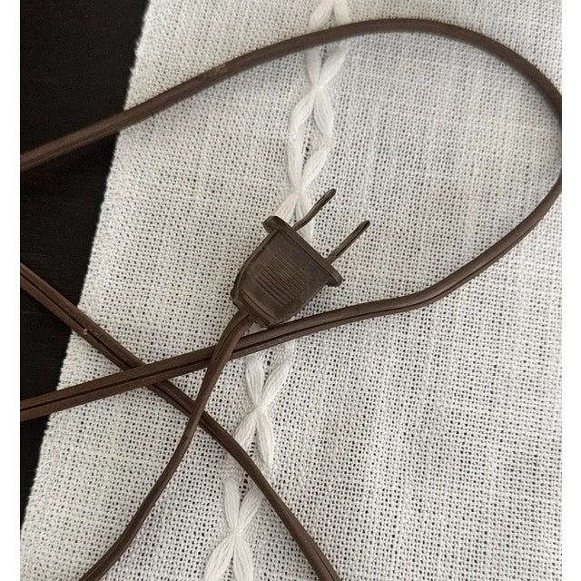 A captivating mid-century European studio pottery lamp dating to the 1950s, showcasing exquisite hand-painted floral...