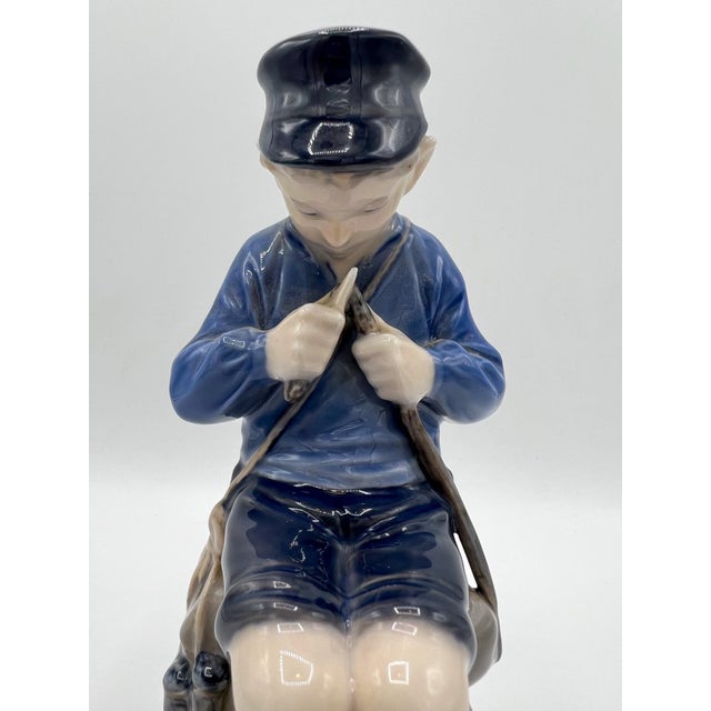 Royal Copenhagen Boy Whittling a stick figurine No. 905. Perfect Condition. Beautiful porcelain figure.