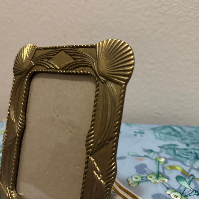 This elegant vintage picture frame captures the essence of mid-century Hollywood Regency and Art Deco revival design....