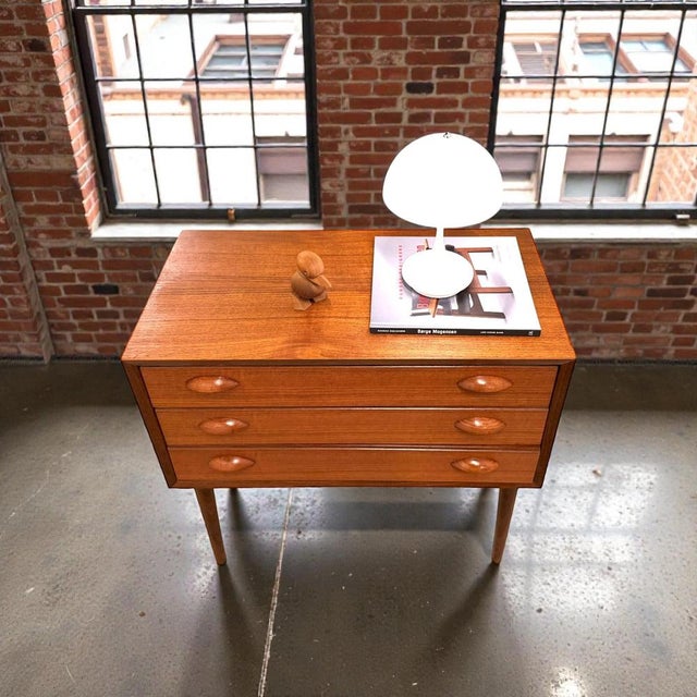 Petite danish teak chest of drawers attributed to arne vodder, denmark, c. 1960s. the cabinet is executed in teak and...