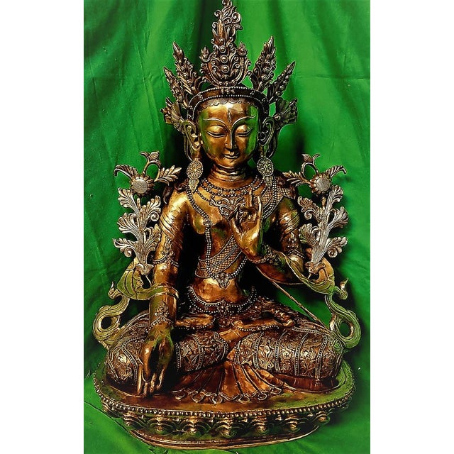 Tibetan bronze, 18./19. Century. Detailed, real original white / white Tara bronze figure, a Tibetan Tara. It rests on a...