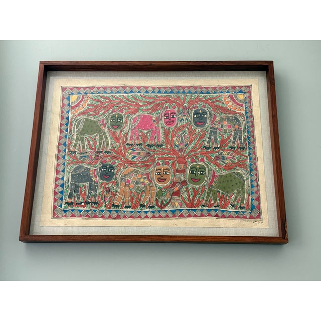 This painting is an original piece of Madhubani art by Lalita Devi who who is described on the back of the piece. It is a...