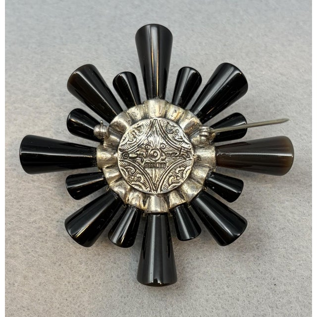 Stephen Dweck Brooch with Black Onyx, Mabe Pearl and Sterling Silver Cones of black onyx set under textured sterling...