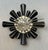 Stephen Dweck Brooch with Black Onyx, Mabe Pearl and Sterling Silver Cones of black onyx set under textured sterling...