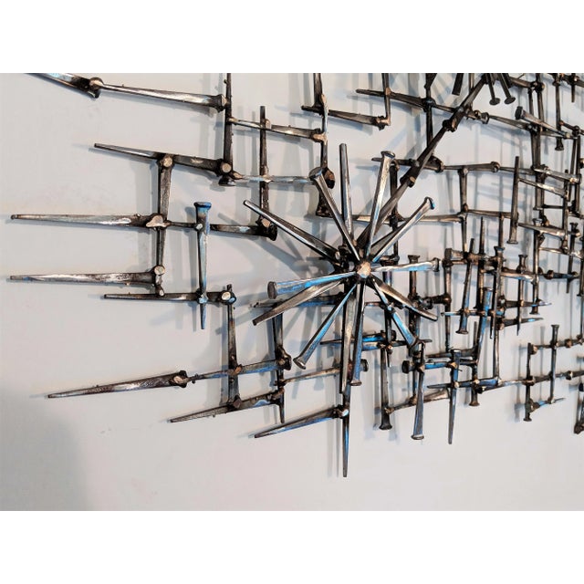 Sculpture is made of vintage mason nails and welded with bronze. I was created in-house by a local Artisan. A wonderful,...