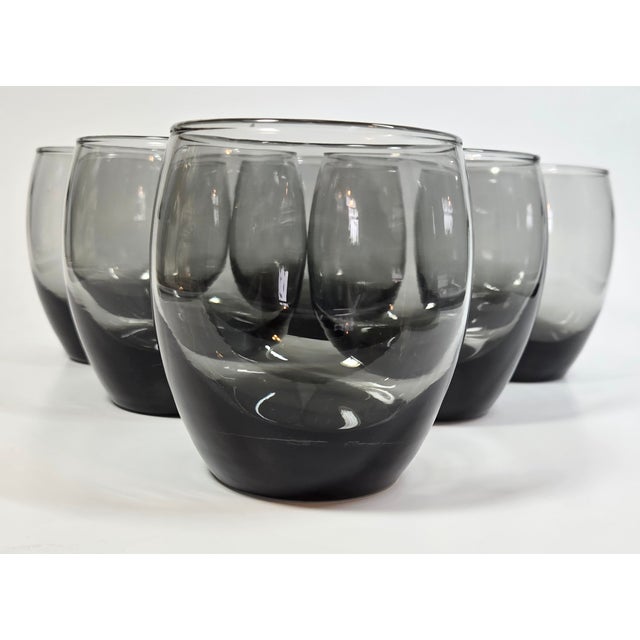 Sleek, simple lines accent these mid century smoky gray to black roly polies. The ultimate casual lowball easily goes from...