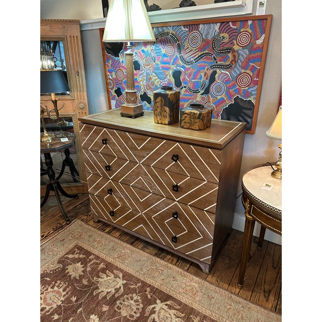 Stylish large & functional natural cerused wood dresser having inlaid cream geometric pattern on the front and the top...