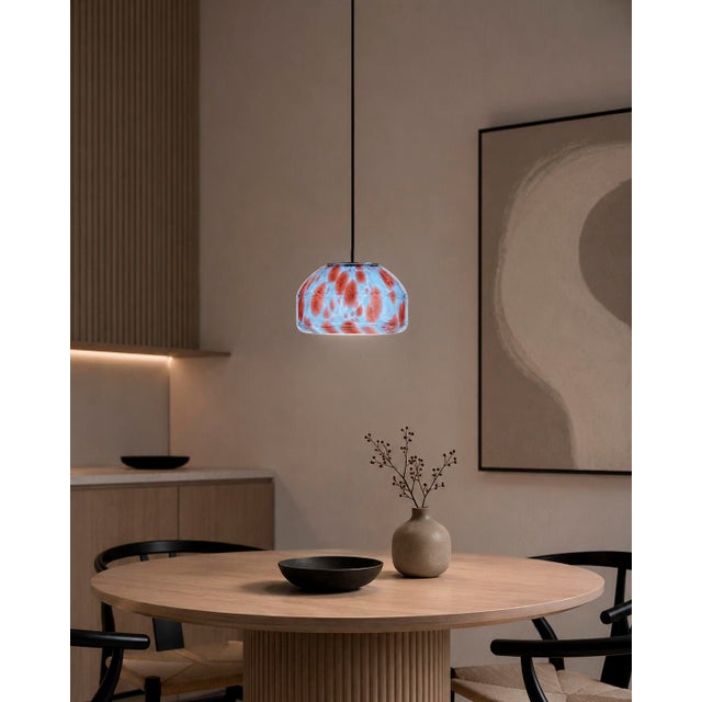Crafted with high visual clarity, this modern pendant lamp features a sleek silhouette hand-blown from premium glass in a...