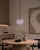 Crafted with high visual clarity, this modern pendant lamp features a sleek silhouette hand-blown from premium glass in a...
