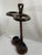 A stunning vintage Victorian Style Umbrella or Stick Stand with metal drip pans, circa 1980s. This solid walnut stand is...
