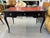 Chic Louis XV style ebonized desk with red tooled leather top and locking drawer. There are 11.5" pull extensions on both...