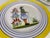 A set of dinner plates by Henriot Quimper.
