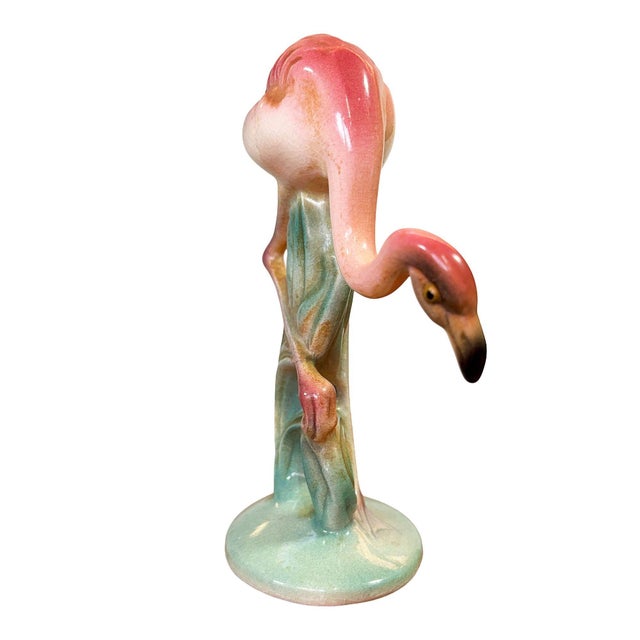 Mid-century pink and green ceramic flamingo tabletop statue by Brad Keeler. It features a beautifully detailed pink...