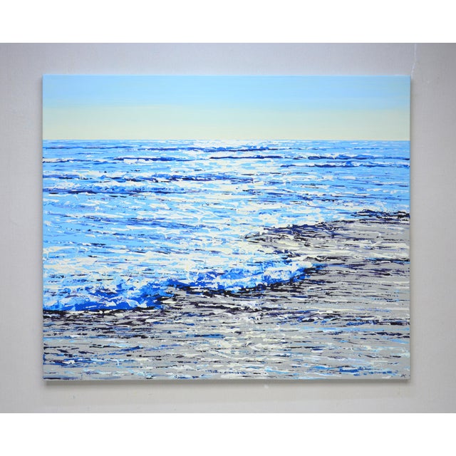 Ocean Blue. Glare 6. Summer seascape: blue water, ocean, small waves, sun glare on the water, sea foam, sand, real sky...