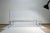 A monumental post modern architectural coffee table by Leon Rosen for Pace. A heavy weight piece with solid bar...