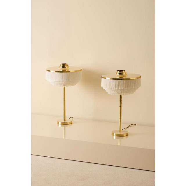 Rare pair of white table lamps model B-138 produced by Hans-Agne Jakobsson in Markaryd, Sweden. This piece is attributed...