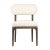 Midcentury modern inspired dining chair with brown mindi wood frame and off-white cotton blend upholstered seat and back....