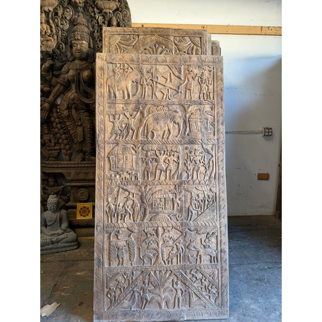 A striking antique tribal Indian carved wood door panel, richly textured with time-worn patina and expressive hand-...