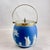 A Wedgwood Jasperware Royal blue Biscuit Barrel with an EPNS lid and swing handle, England, circa 1910-1930. The barrel...