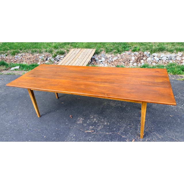 A charming early 20th century New England country vernacular harvest table, likely made in a small local workshop in New...