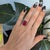 A dramatic Estate 13.90-carat Madagascar ruby takes center stage as a bold emerald-cut solitaire in solid 10K yellow gold....