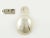 An early 19th C French silver caddy spoon. The caddy spoon is embellished with a bright-cut engraving of drapery valance...