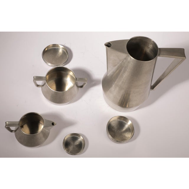 Pewter coffee set with following dimensions: Coffee Pot 16x12x19H, Sugar Pot 11x8x7,5H, Cream Pot 9.5x6.5x7H. All parts a...