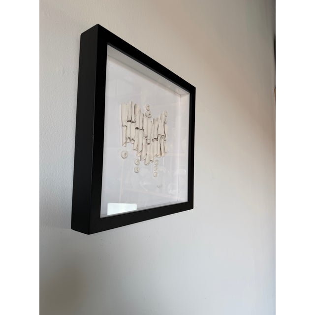 A striking 1990s vintage ceramic wall sculpture signed C. Marhg Sirt, featuring an organic abstract composition of hand-...