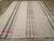 A vintage Turkish flatweave Kilim room size carpet handmade during the mid-20th century. Measures: 10' 7" x 14' 1".