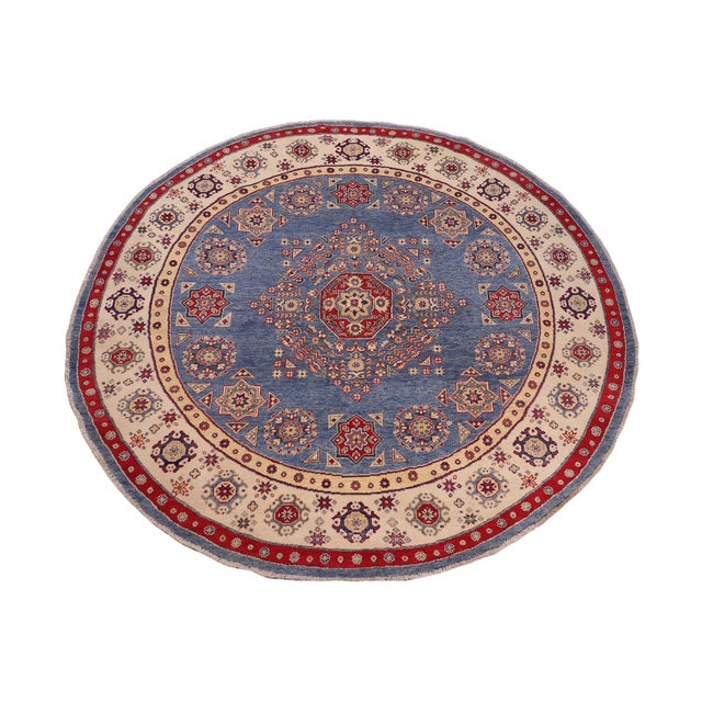 Enhance your home with this exquisite hand-knotted Kazak rug, crafted from fine hand-spun wool and dyed with all-natural...