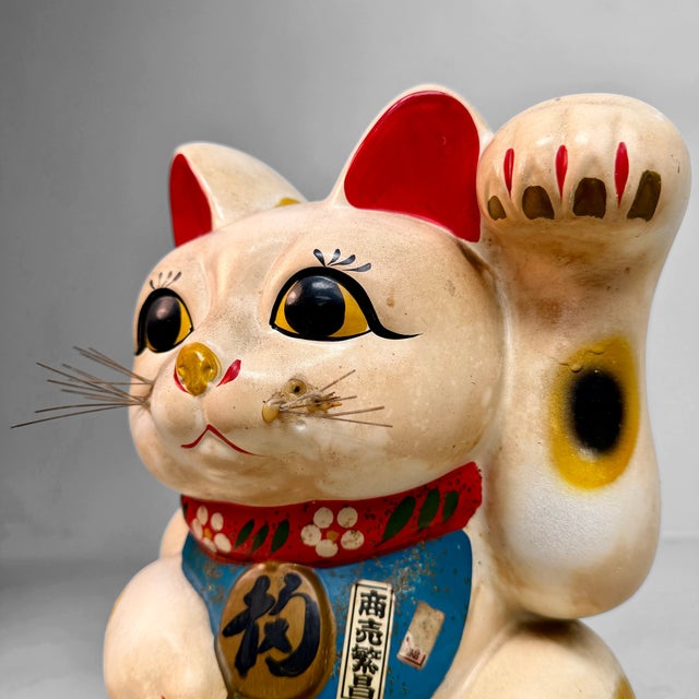 Decorative Japanese maneki-neko, or lucky cat, from the 1950s. Dimensions: height 31 cm, width 24 cm, depth 21 cm. This...