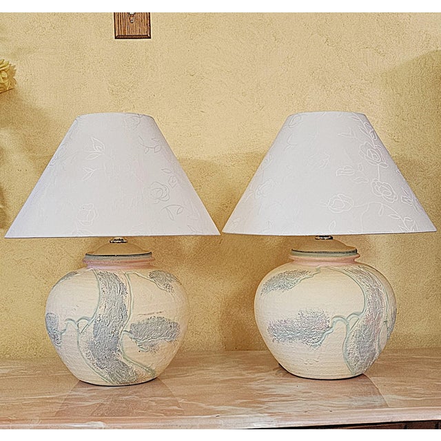 1980s American Postmodern table lamps with rounded sculptural ceramic bodies and raised abstract botanical/tree motifs....
