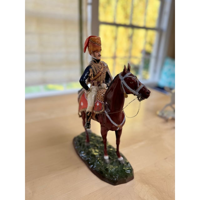 A beautiful porcelain statue of European origin of a soldier of the 10th Hussars regiment.