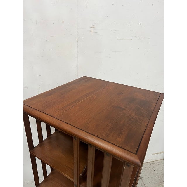 Large rotating bookcase in solid walnut three storage shelves tripod base with casters dated 4/1911 for l. Villot maison...