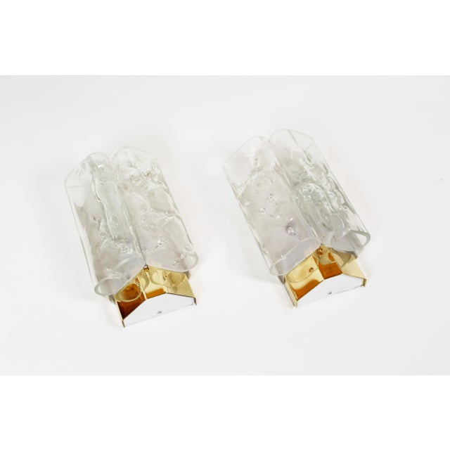 Beautiful set of glass wall lamps by the German company Doria Leuchten. Each lamp features 2 pieces of glass, with a...