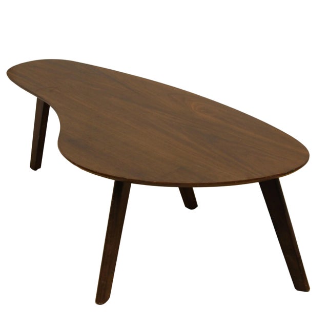 Small, iconic mid century shaped coffee table. Solid walnut wood. Unmarked. Condition: Good vintage condition, signs of...