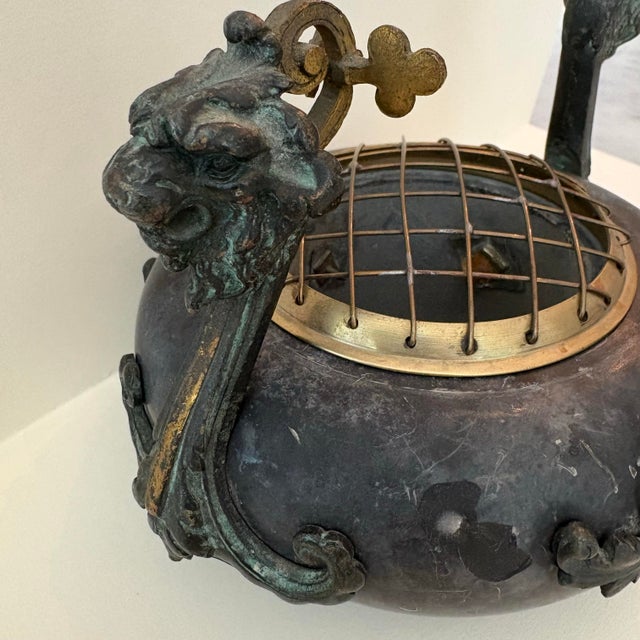 A wonderfully sculptural early 20th-century Chinese Export censer, handcrafted from a substantial charcoal-gray carved...