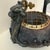 A wonderfully sculptural early 20th-century Chinese Export censer, handcrafted from a substantial charcoal-gray carved...