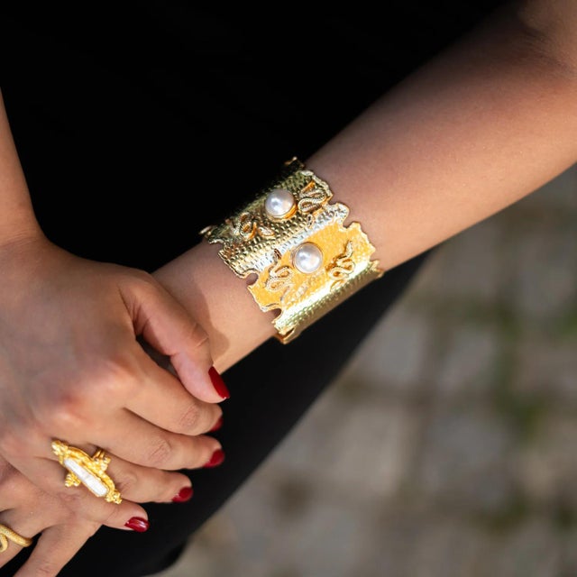 Embrace the perfect fusion of strength, transformation, and purity with this bold chunky gold cuff bracelet. Crafted from...