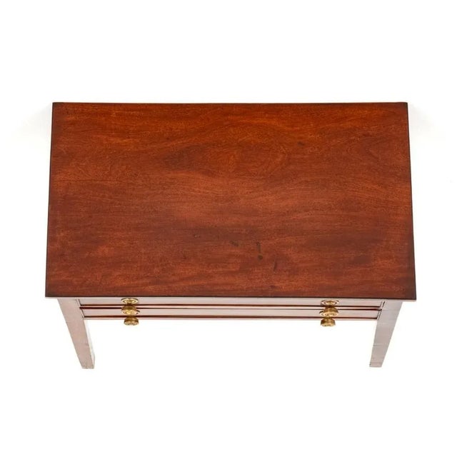 George II Mahogany Side Table. This Side Table is of a Plain Form. 19th Century Standing on Tapered Legs. The Table...