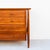 A newly refinished 1950s mid century modern exoskeletal twelve drawer walnut chest of drawers with brass hardware by Mount...