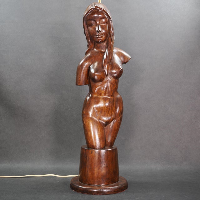 A skillfully hand-carved wooden bust of a nude woman forms the base of this large lamp. Classy piece from the large estate...