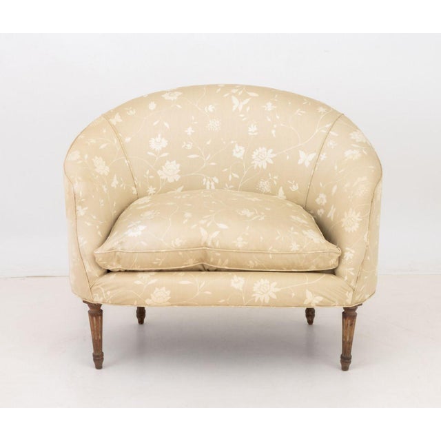 Brunschwig et Fils Upholstered Lounge Chair, butterfly and flowers pattern beige upholstery on tapered fluted wood legs....