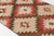 This is a vintage Turkish Oushak rug from the Mid 20th Century. The piece was hand-knotted.