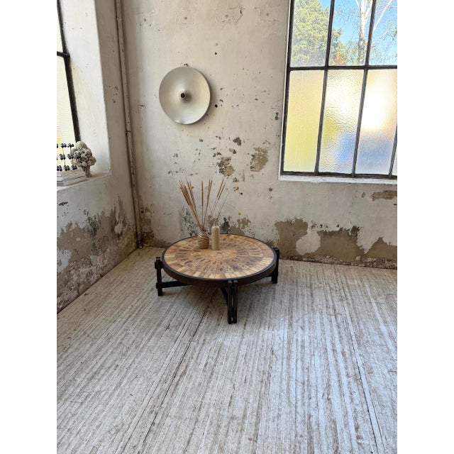 Very elegant wood and ceramic coffee table from the 1950s by Roger Capron. We love the wooden surround which contrasts...