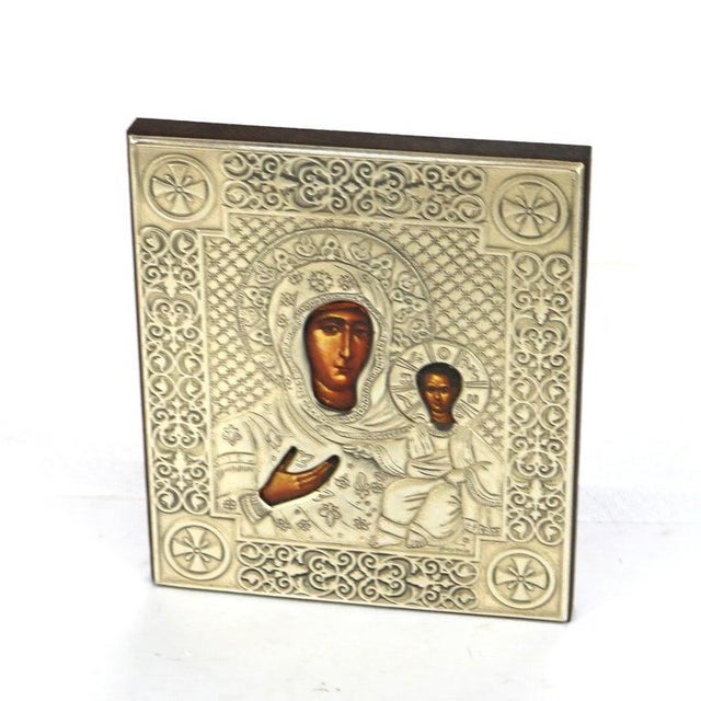 Russian Religious Icon Portrait of Mary & Baby Jesus Encased In Sterling Silver. 7" x 6 1/8" x 5/8". A beautifully crafted...