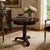 Elegant Baker Furniture pedestal table crafted in rich mahogany with a classic tripod base and beautifully figured...