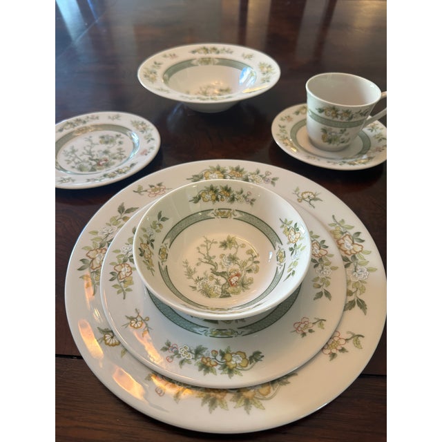 A rare and comprehensive service for twelve in the sophisticated "Tonkin" pattern (TC1107) by Royal Doulton. This pattern...
